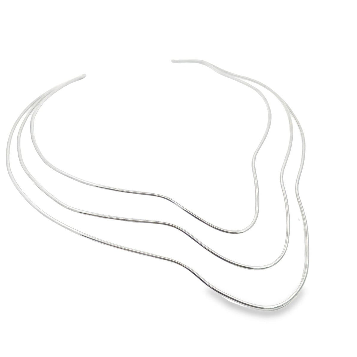 A modern silver choker necklace with a sleek, multi-strand wavy design rests against a clean white background.