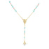 A delicate gold rosary necklace features alternating pastel pink and blue beads leading to a central pendant of the Virgin Mary and a small cross.