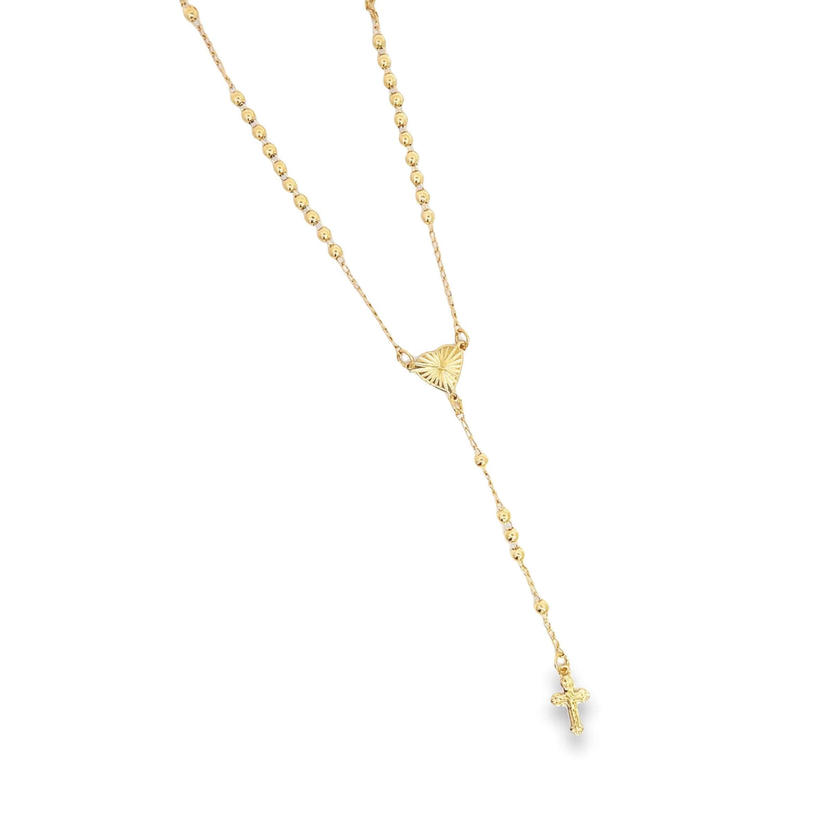A delicate gold rosary necklace features polished beads, a textured heart-shaped center, and a matching crucifix pendant against a clean white background.