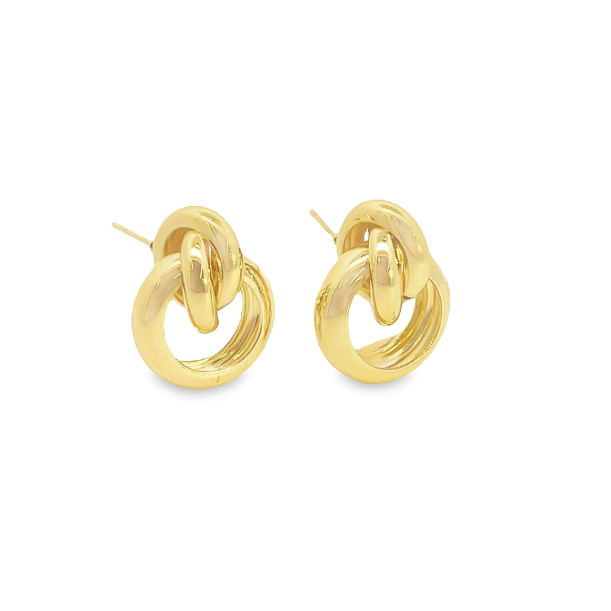 Two polished gold interlocking hoop earrings rest against a clean white background.