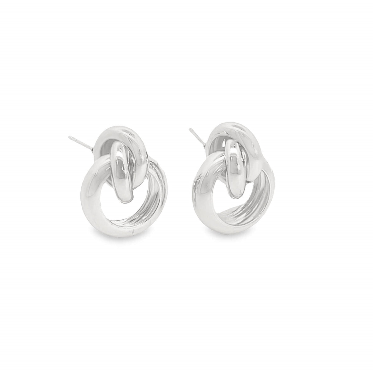 A pair of polished silver interlocking knot stud earrings rests against a clean white background.