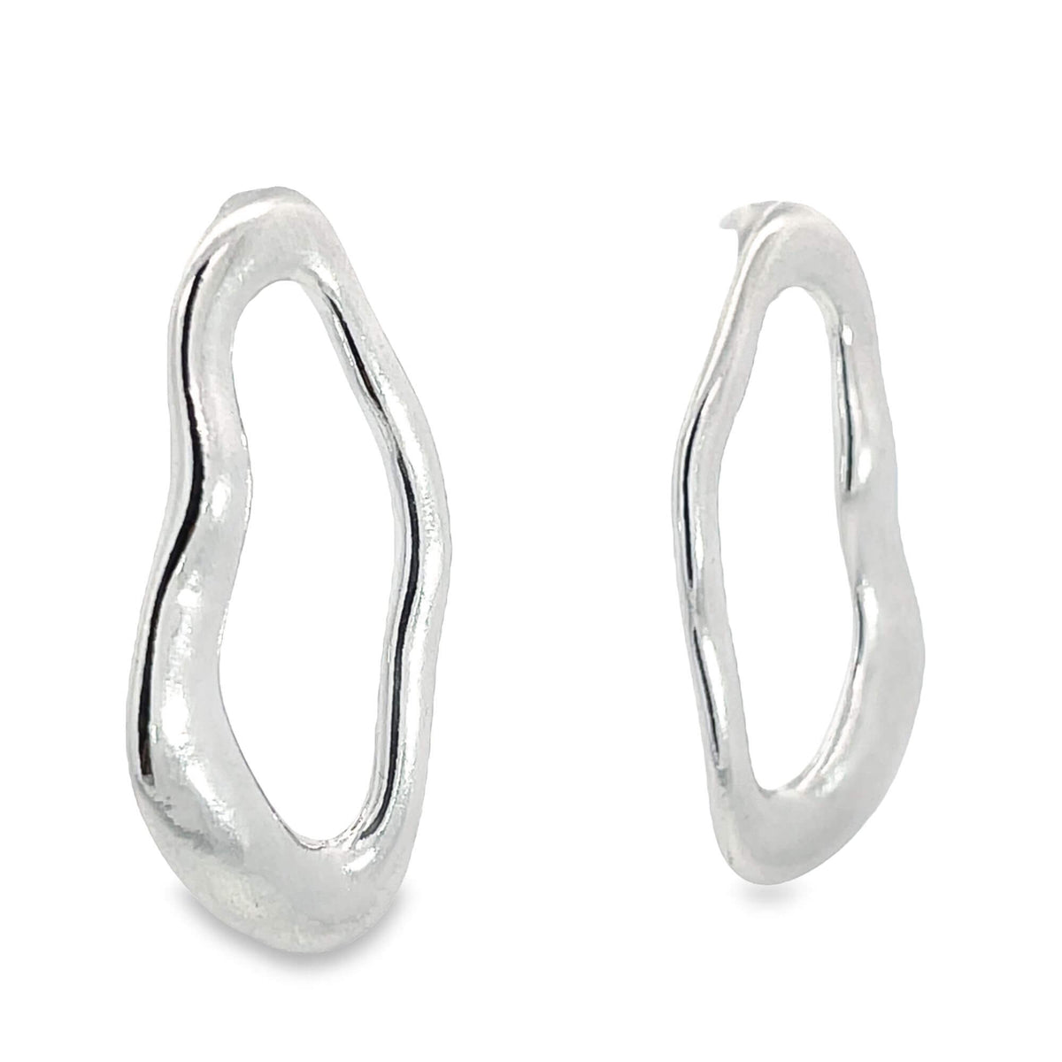 A pair of modern silver organic-shaped hoop earrings gleams against a clean white background.