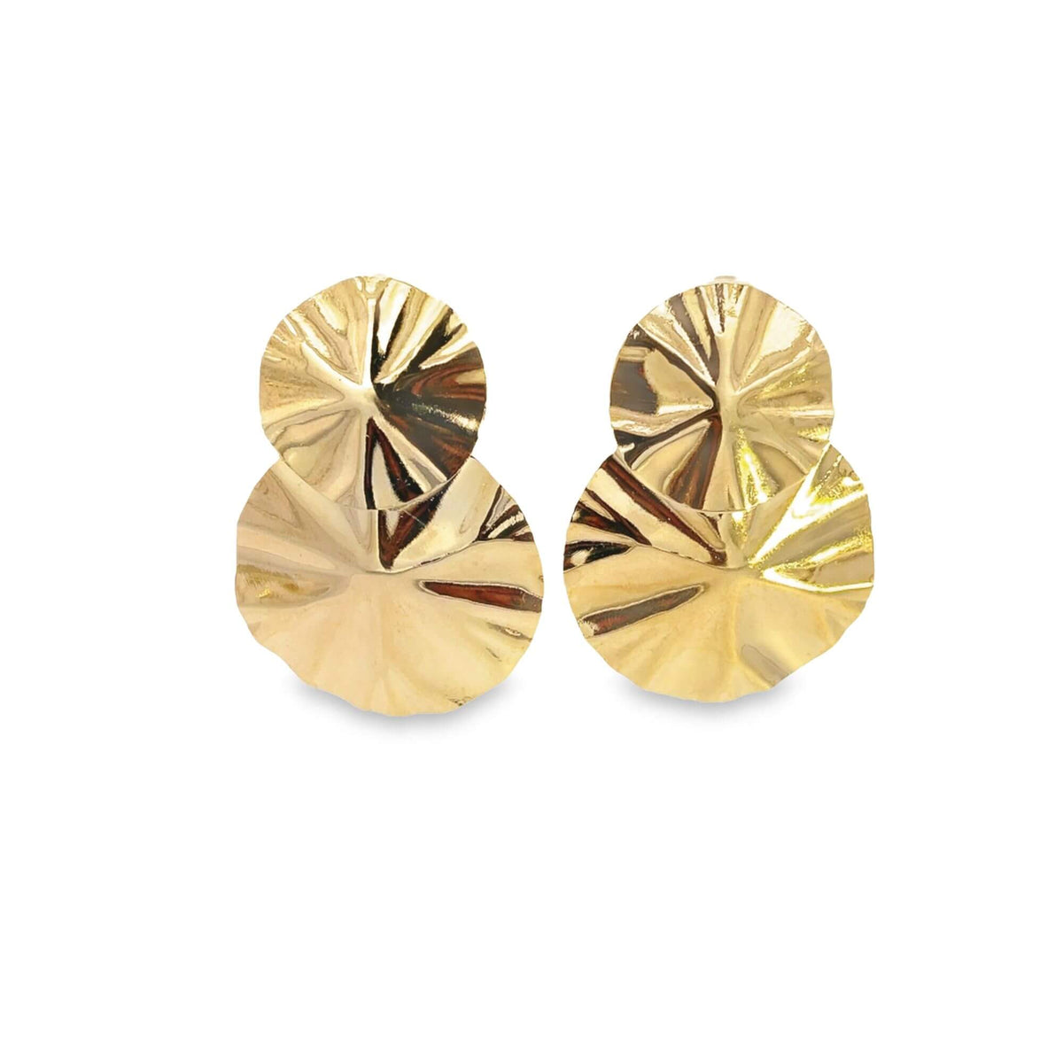 A pair of statement gold earrings features overlapping pleated disc designs against a clean white background.