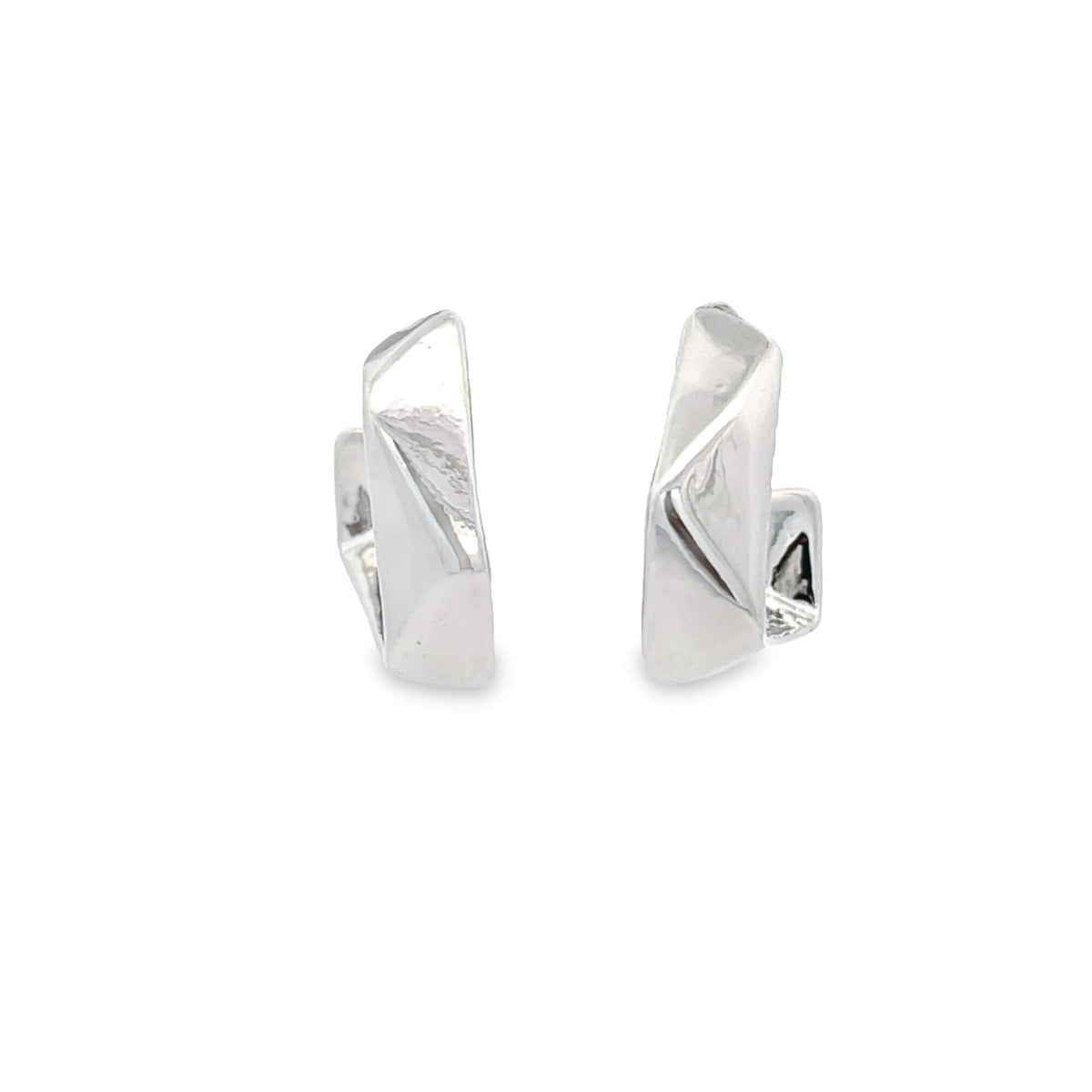 A pair of modern geometric silver hoop earrings display unique faceted designs against a clean white background.