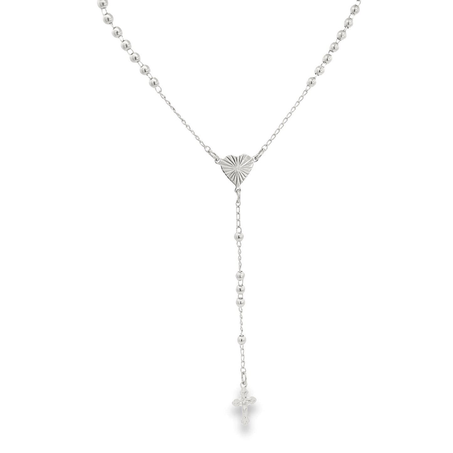 A delicate silver rosary necklace features small ball beads, a sunburst-textured heart centerpiece, and a matching crucifix pendant.
