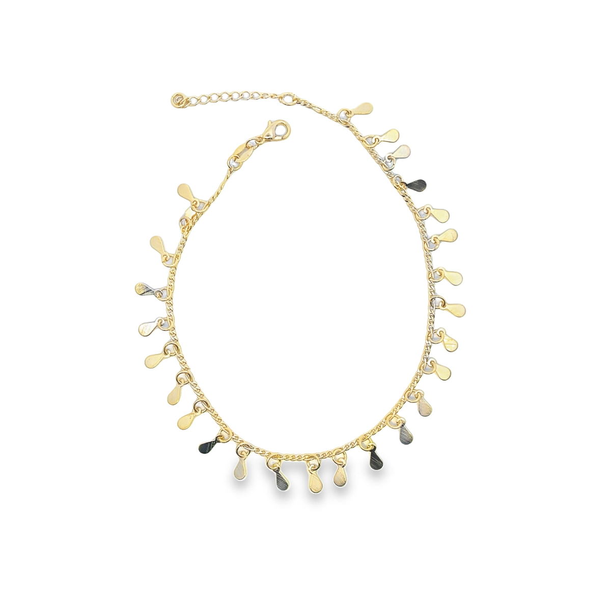 A delicate gold anklet features dangling teardrop charms against a white background.