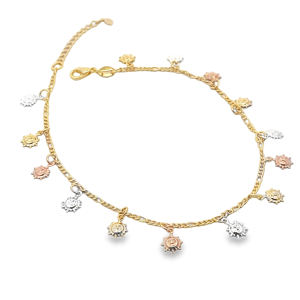 A delicate gold charm anklet features dangling tri-color sun charms in yellow, white, and rose gold.