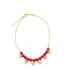 A delicate gold chain necklace sparkles against a plain white background, featuring dangling red crystal beads and tiny gold heart charms.