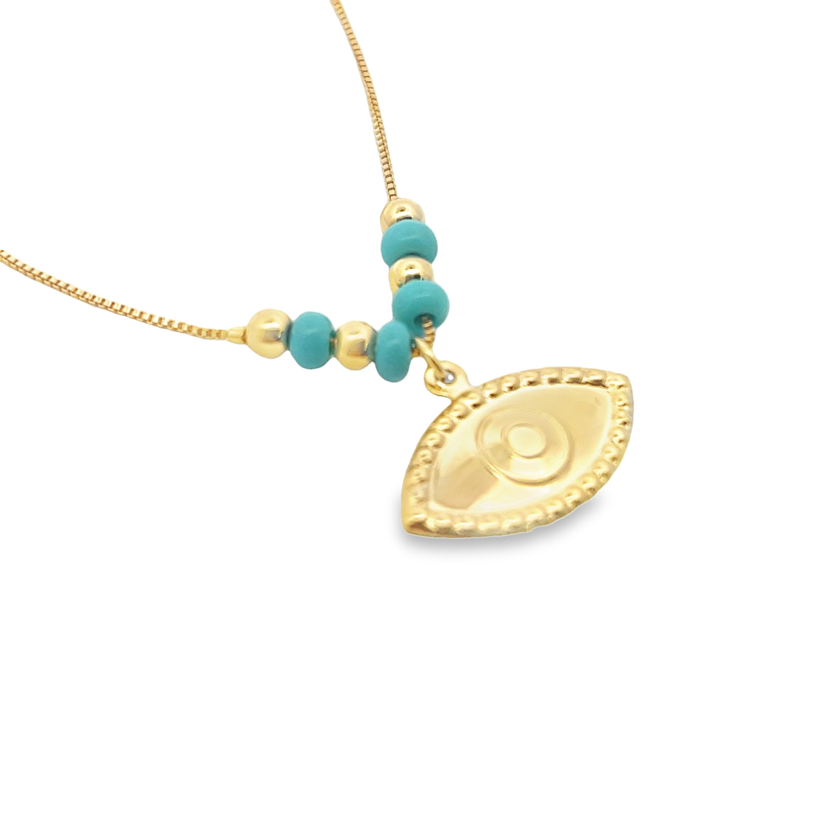 A delicate gold evil eye necklace features turquoise beads and a golden pendant against a white background.