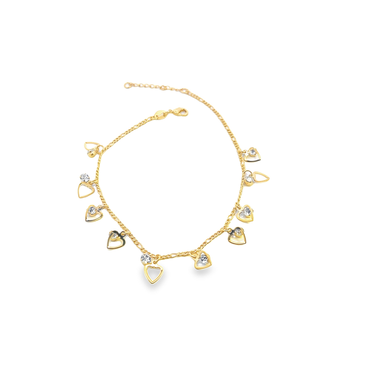 A delicate gold chain anklet dangles sparkling rhinestone heart charms against a clean white background.