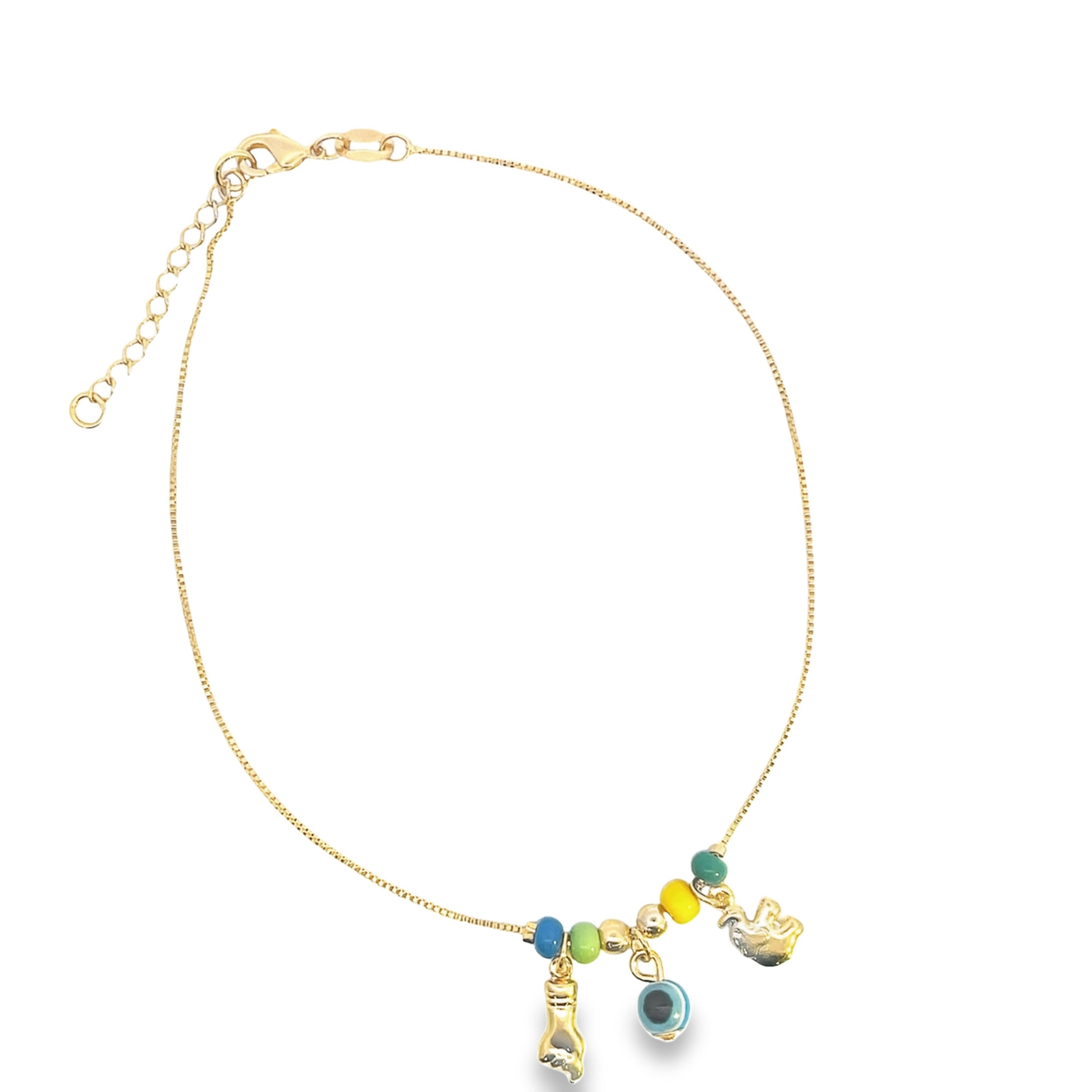 A delicate gold chain bracelet features colorful enamel charms, including an evil eye bead and a golden hand pendant.