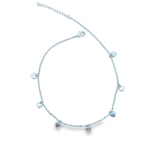 A delicate silver chain anklet features multiple dangling heart charms against a clean white background.