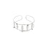 A silver cuff bracelet features an open-band design adorned with delicate leaf-shaped charms.