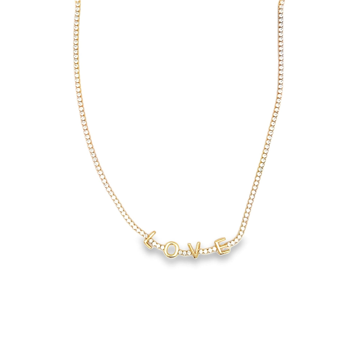 A delicate gold tennis necklace features sparkling diamond accents and spells out the word LOVE in charming pendant letters.