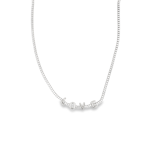 A sparkling diamond tennis necklace features the word LOVE spelled out in shimmering gemstone letters.