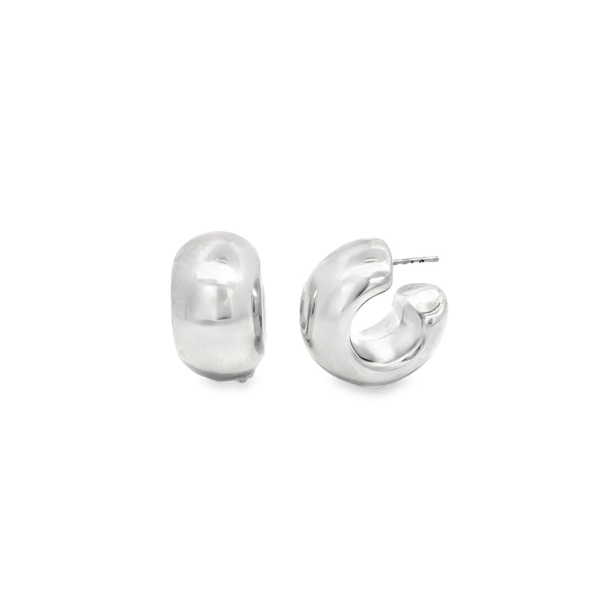 A pair of thick, polished silver hoop earrings rest side by side against a plain white background.