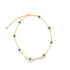 A gold evil eye anklet features alternating blue and white glass beads connected by delicate metal bars and an adjustable chain.