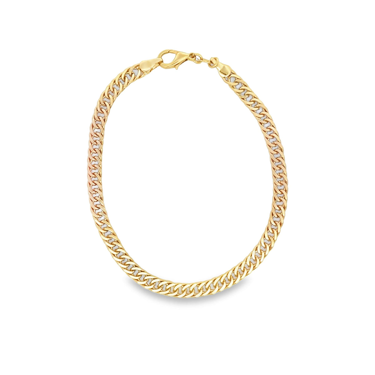 A polished gold cuban link chain necklace curves gracefully against a plain white background, highlighting its secure lobster clasp closure.