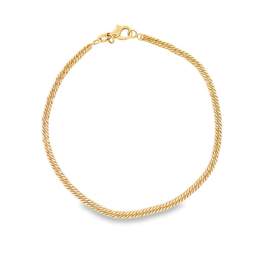 A shiny gold curb chain necklace forms a circle against a white background.