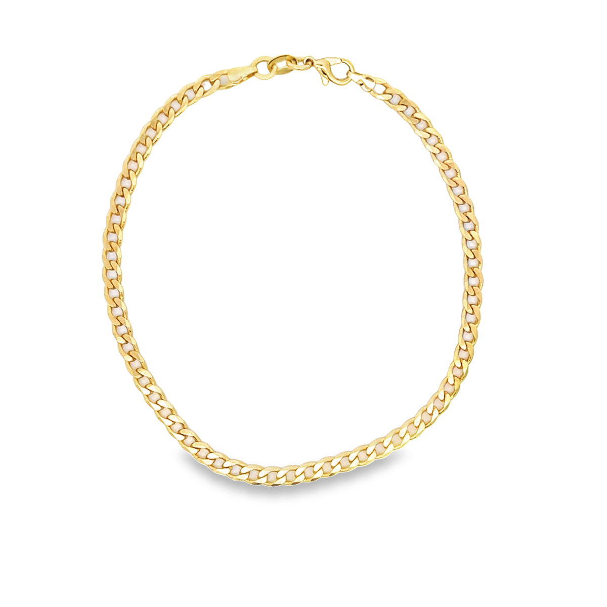 A shiny gold curb chain necklace rests gracefully in a circular shape against a clean white background.
