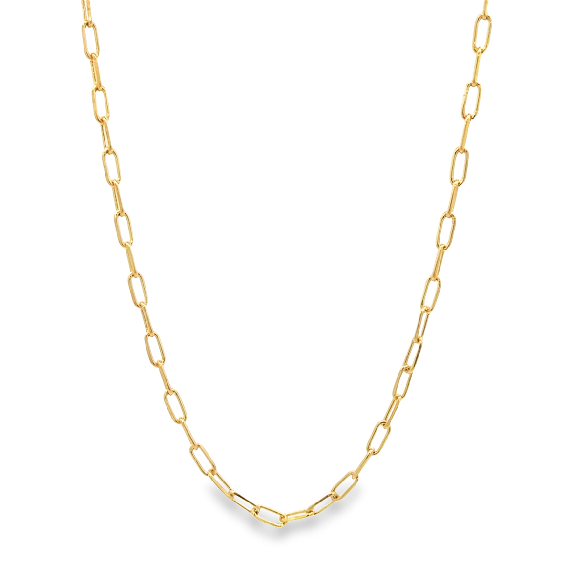 A delicate gold paperclip chain necklace drapes against a clean white background.