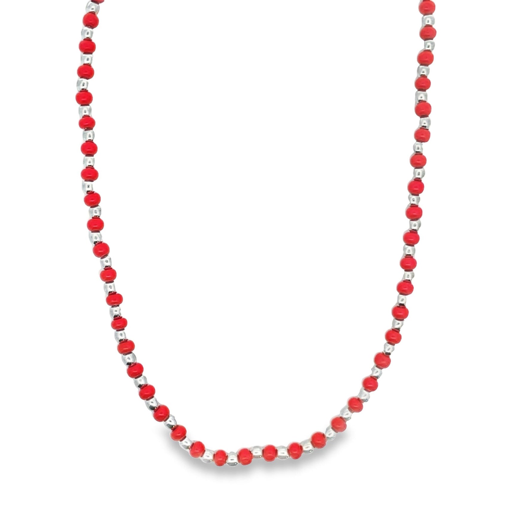 A vibrant red beaded necklace features alternating silver spacer beads along its length.