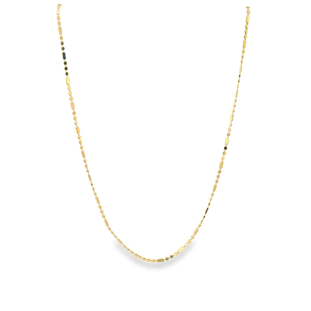 A delicate gold chain necklace with alternating round beads and rectangular links hangs against a clean white background.