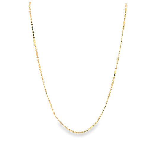 A delicate gold chain necklace with alternating round beads and rectangular links hangs against a clean white background.