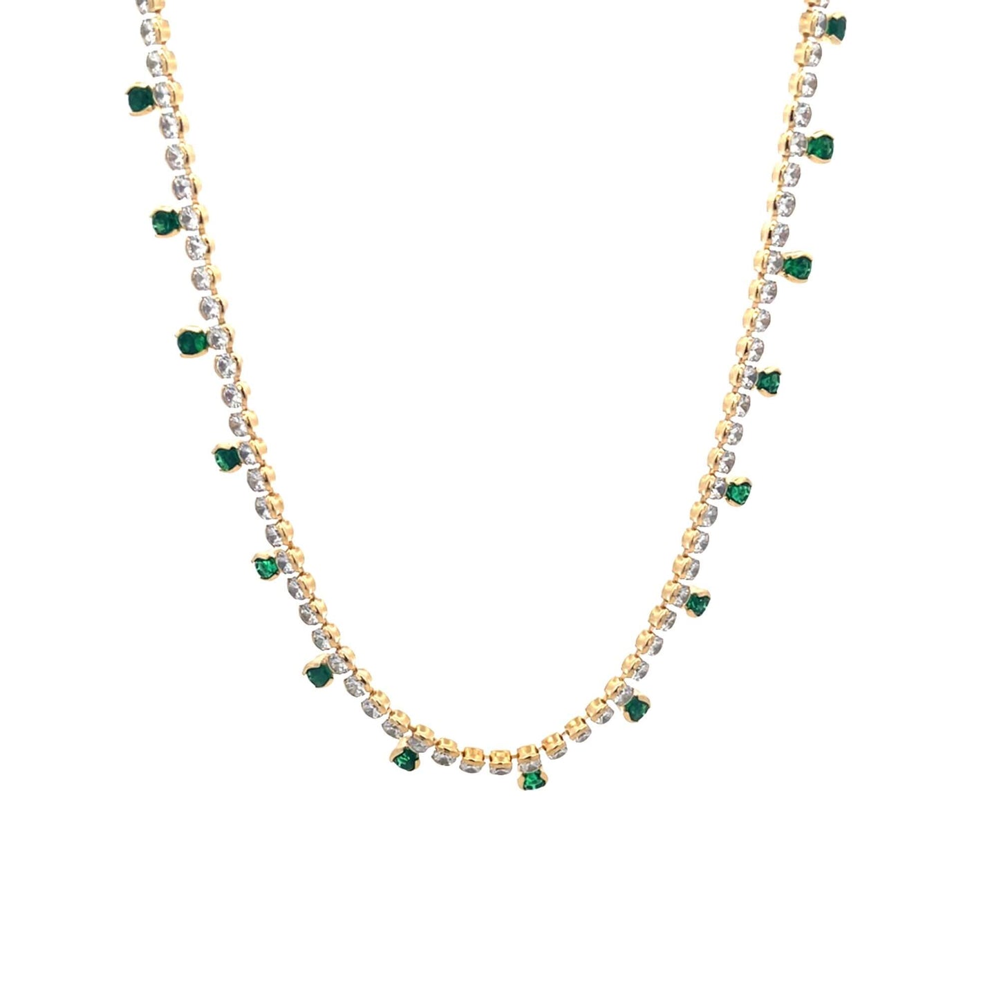 A delicate gold necklace sparkles with clear rhinestones and hanging green gemstone drops against a clean white background.