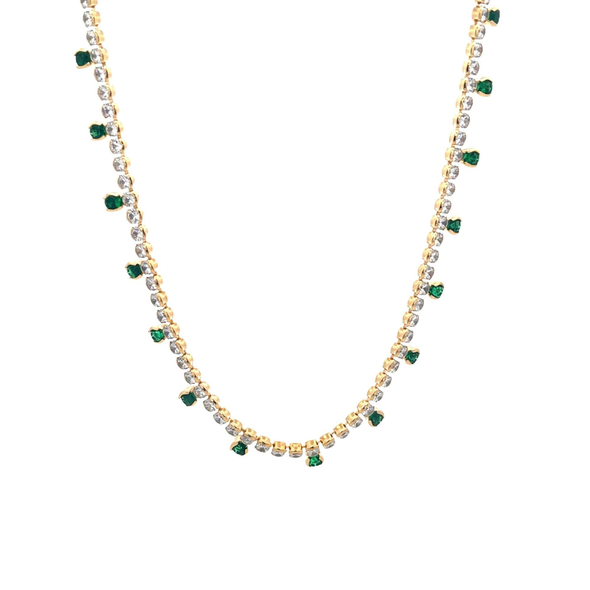 A delicate gold necklace sparkles with clear rhinestones and hanging green gemstone drops against a clean white background.