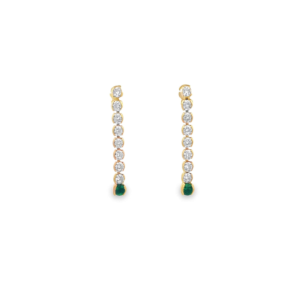 A pair of gold drop earrings features vertical lines of sparkling diamonds ending in vibrant green emeralds.