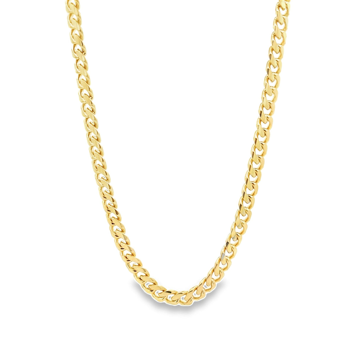 A thick gold curb chain necklace hangs gracefully against a plain white background.