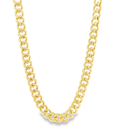 A thick, polished gold cuban link chain rests against a clean white background.