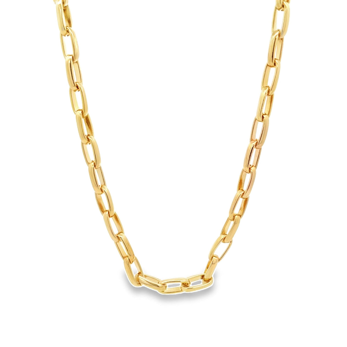 A thick yellow gold paperclip chain necklace rests against a clean white background.