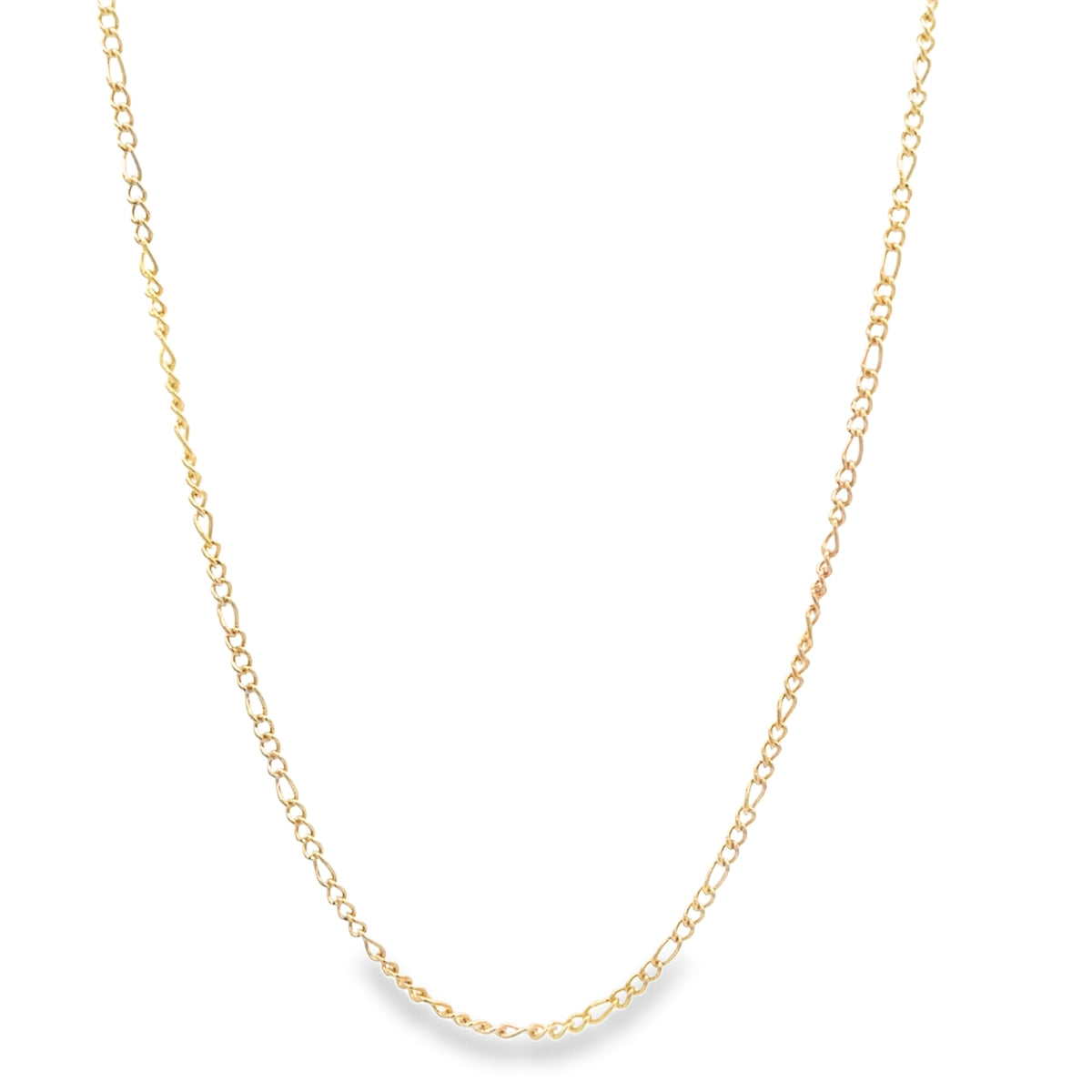 A delicate gold Figaro link chain necklace drapes gracefully against a white background.
