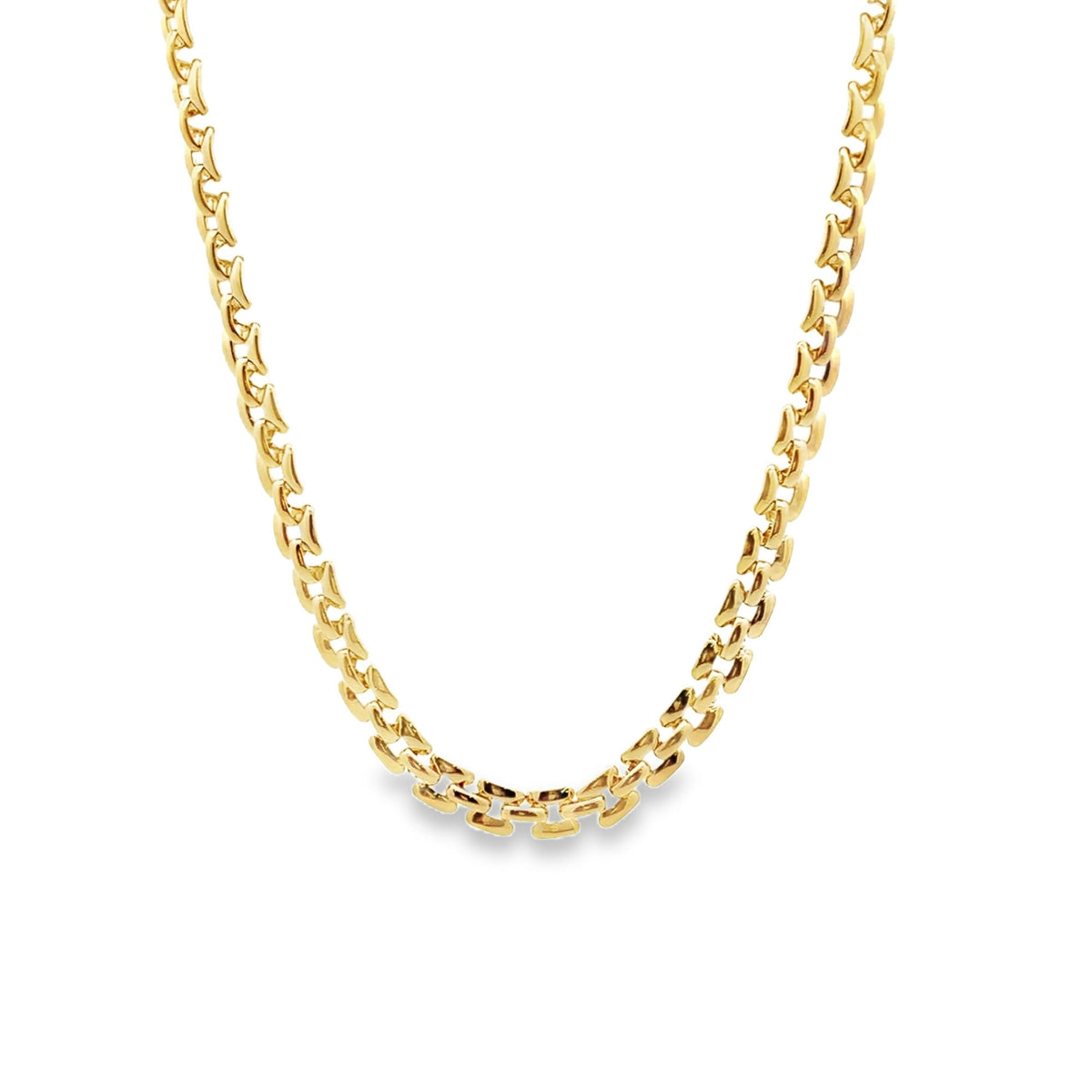 A gleaming yellow gold link chain necklace drapes against a clean white background.