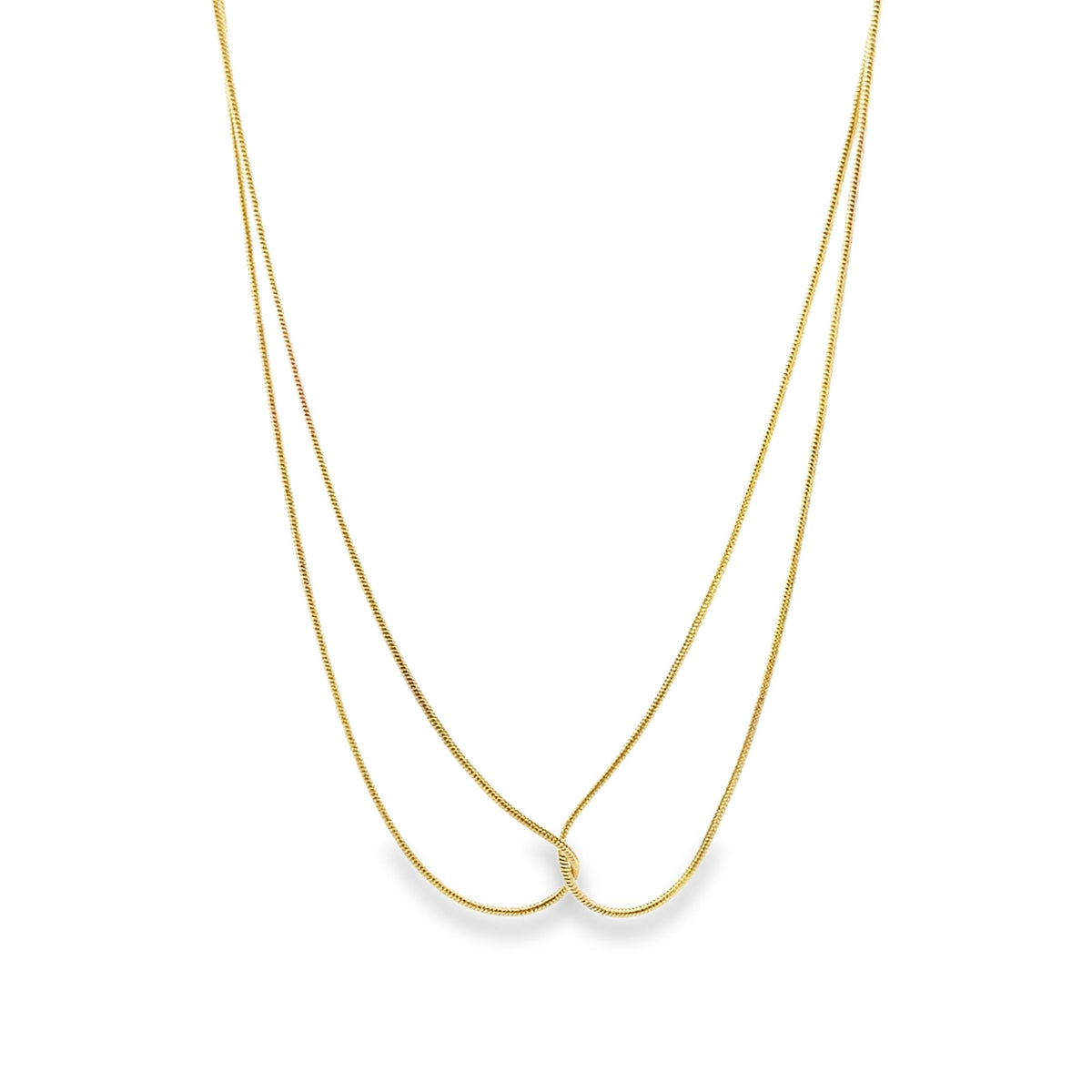 A delicate double-layered gold snake chain necklace rests against a clean white background.