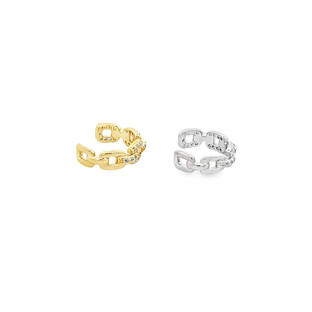 A pair of gold and silver chain link ear cuffs sparkle against a white background.