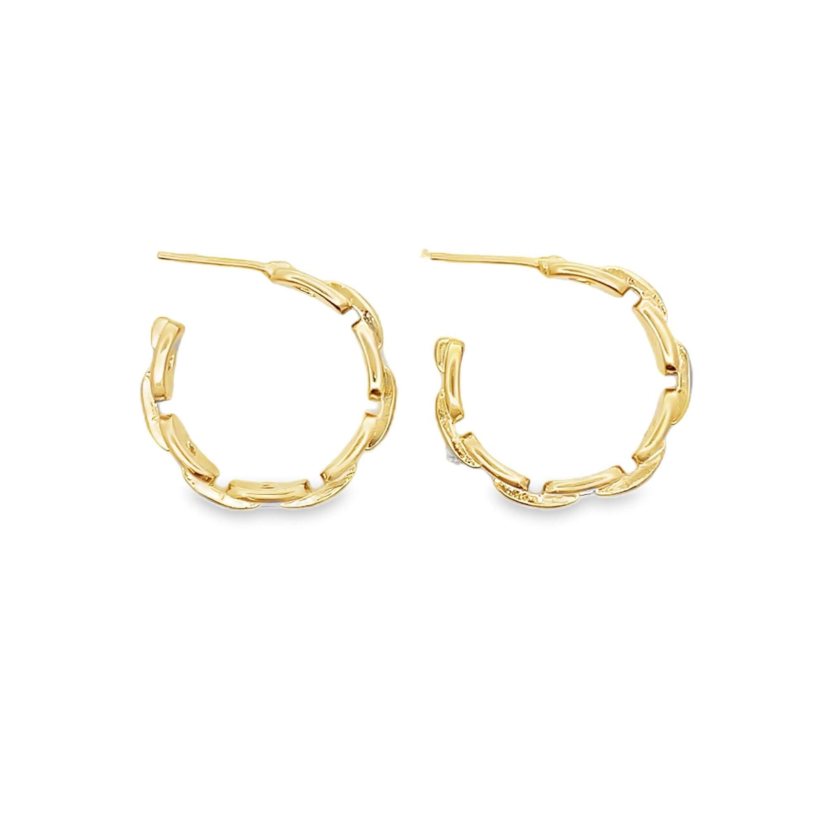 A pair of gold hoop earrings features an intricate, interlocking link design against a clean white background.
