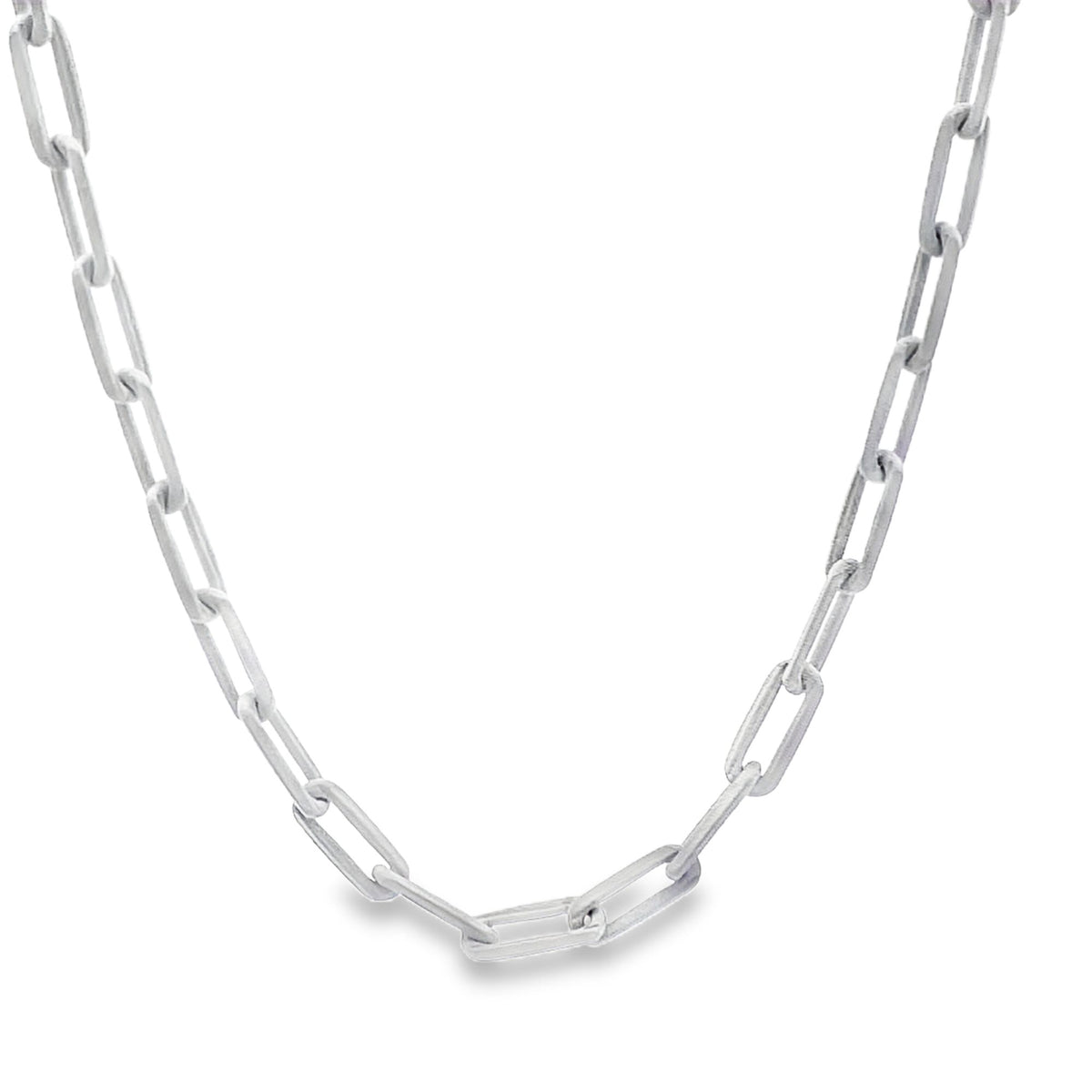 A stylish silver paperclip chain necklace drapes against a clean white background.