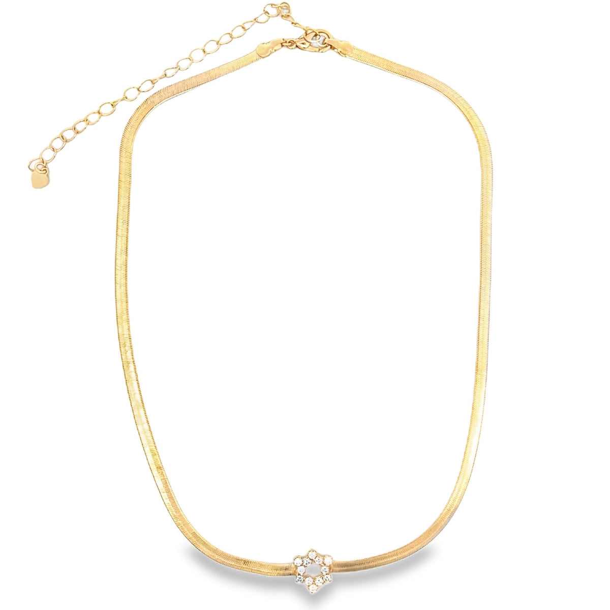 A gold herringbone chain necklace features a sparkling crystal flower pendant at the center against a plain white background.