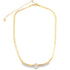 A gold herringbone chain necklace features a sparkling crystal flower pendant at the center against a plain white background.