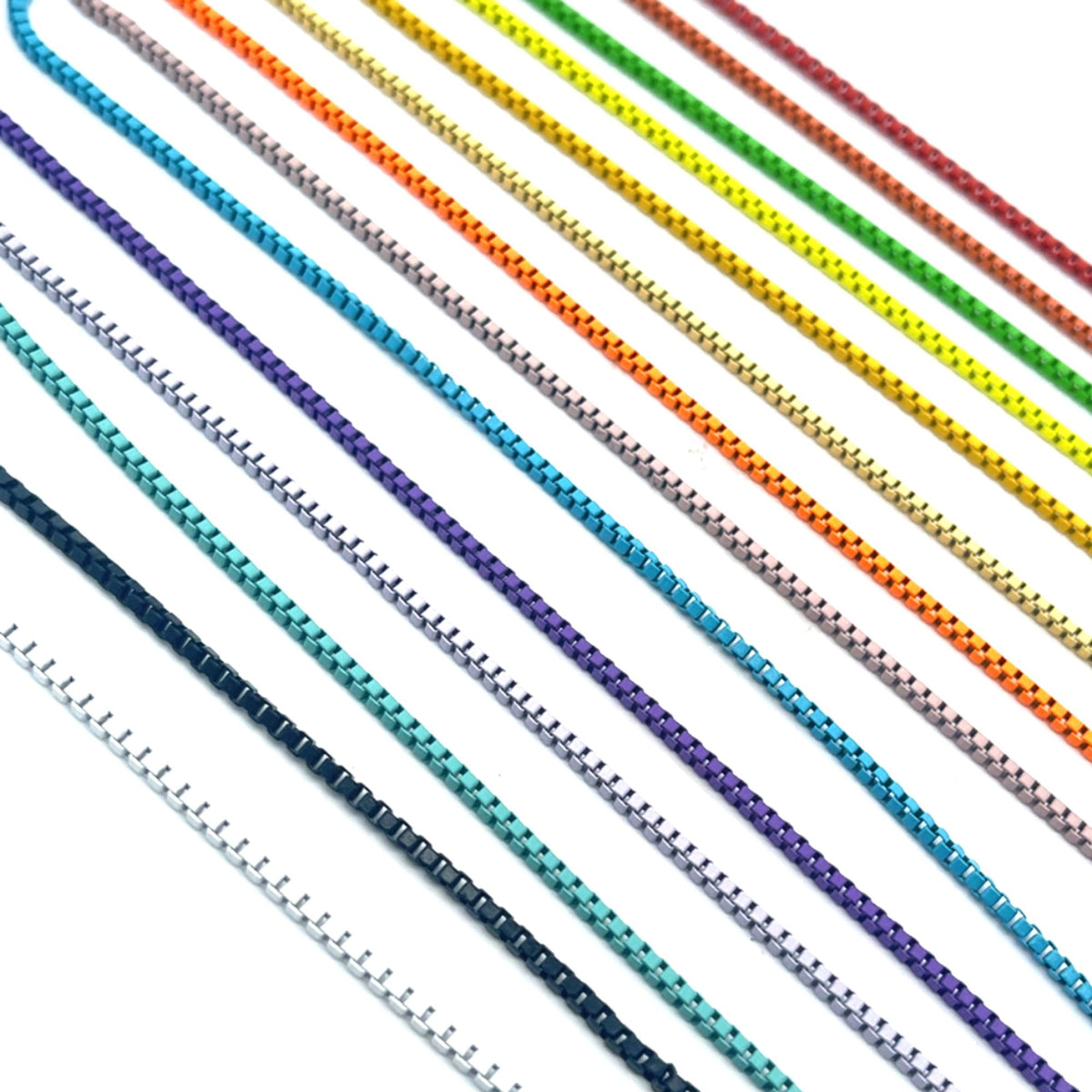 Multiple colorful metal box chains span diagonally across a clean white background, showcasing a vibrant rainbow spectrum from red and green to blue and purple.