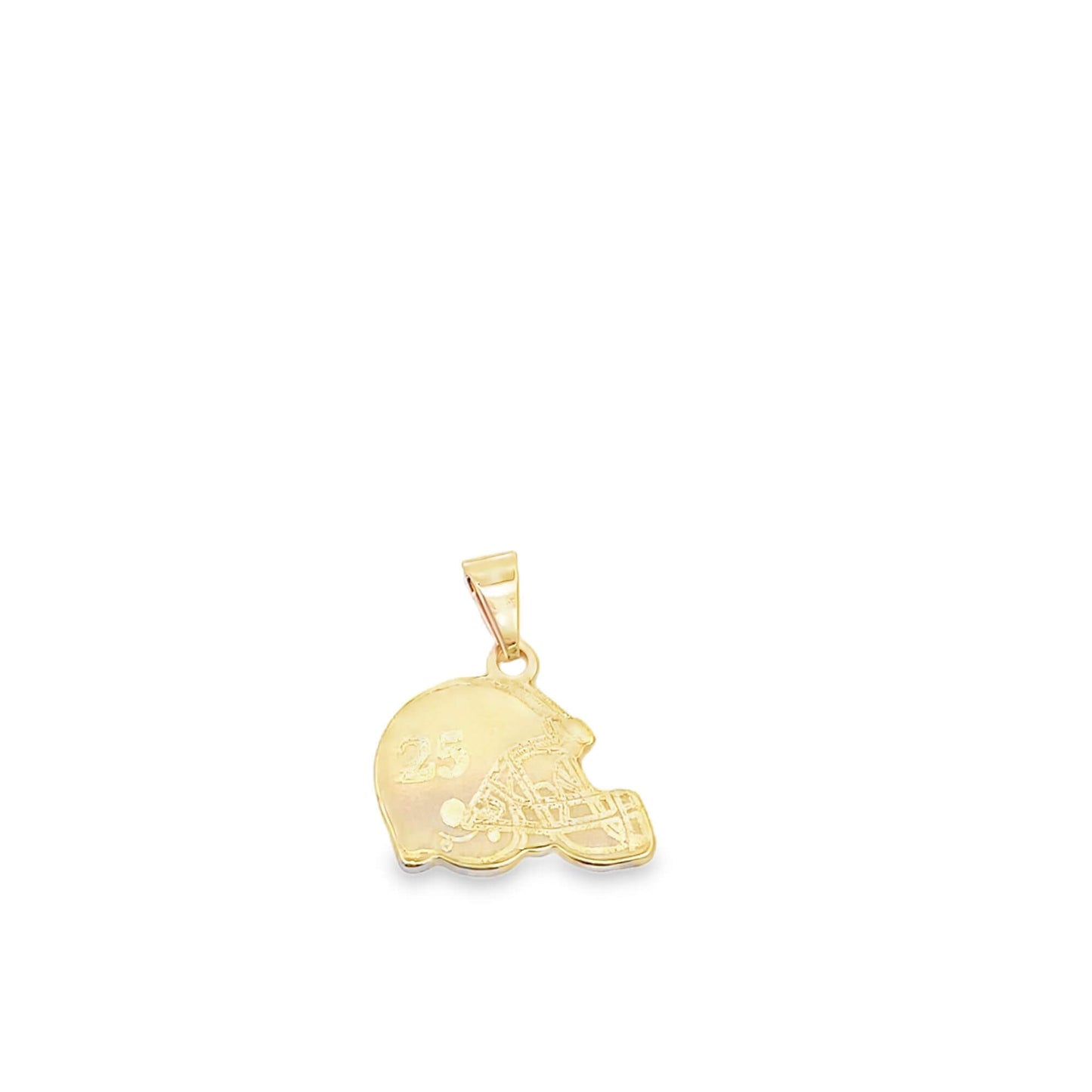A gold football helmet pendant featuring the number 25 rests on a white surface.