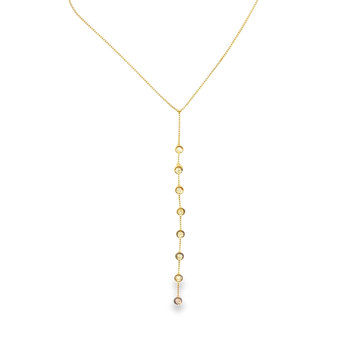 A delicate gold lariat necklace features a vertical drop set with sparkling bezel-set crystals.