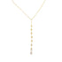 A delicate gold lariat necklace features a vertical drop set with sparkling bezel-set crystals.