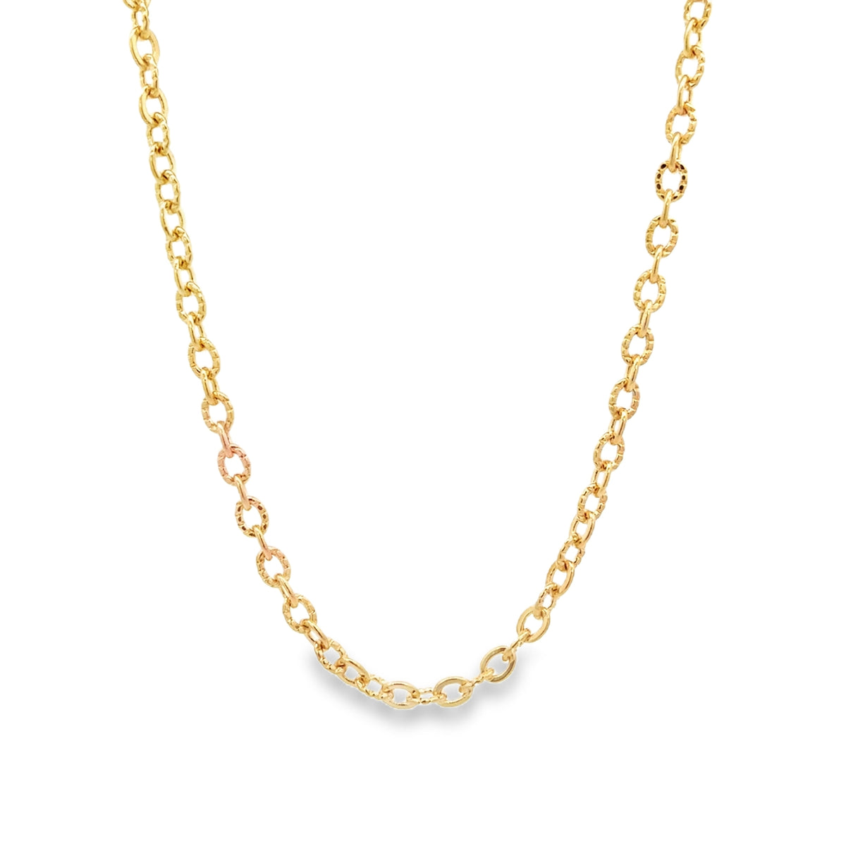 A delicate gold chain necklace drapes against a clean white background.