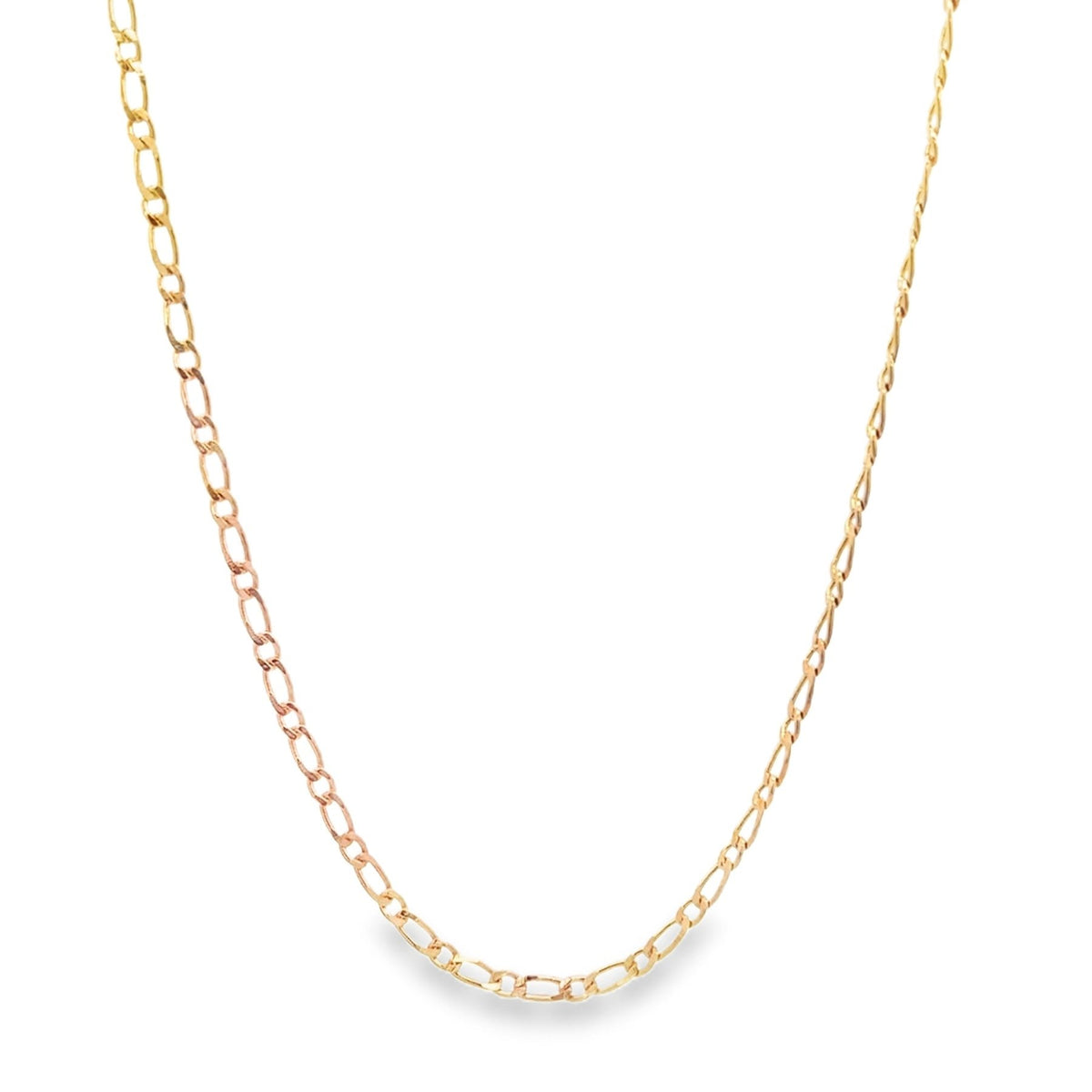 A delicate tricolor gold Figaro link chain necklace drapes against a clean white background.