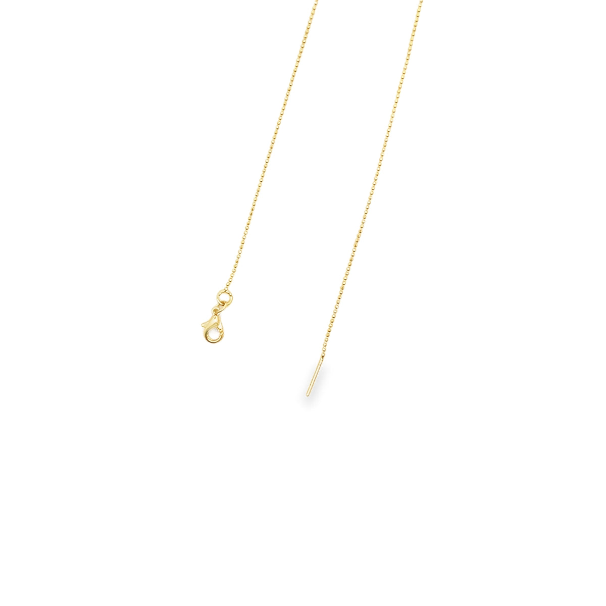 A delicate gold chain necklace with a lobster clasp rests on a plain white background.