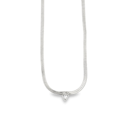 A silver herringbone chain necklace features a dangling triangular gemstone pendant against a plain white background.